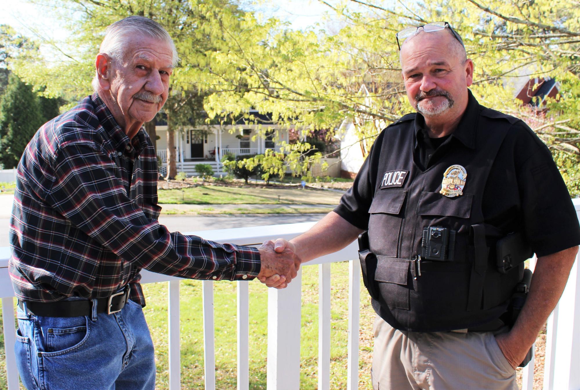 Summit Chase Drive resident Joseph Jones and Snellville Code Enforcement Officer Johnny Greene.