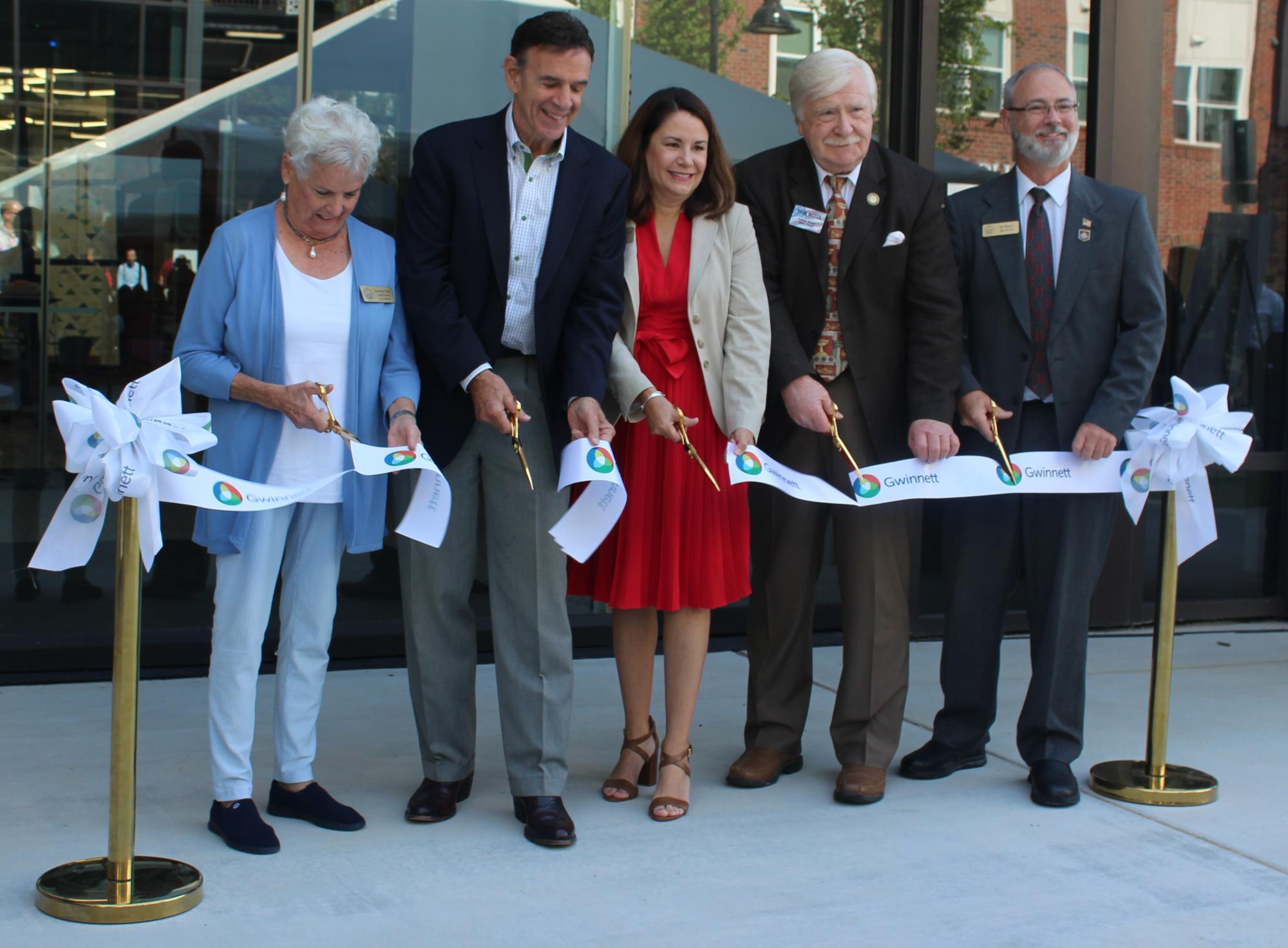 officials cut ribbon